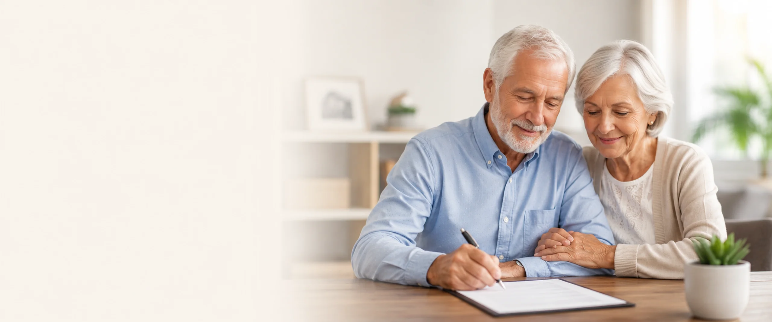 Elderly couple reviewing and signing final expense insurance paperwork at home